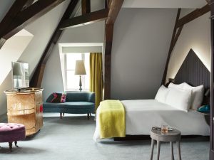 a living room filled with furniture and a tv