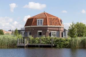 a large body of water in front of a house