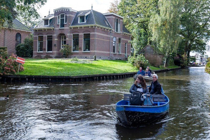 a group of people on a boat in the water